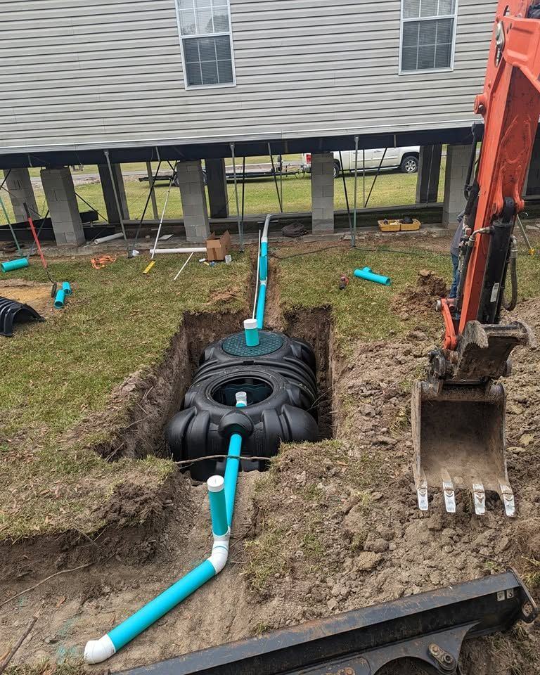 A tank set and plumbed under a raised home.